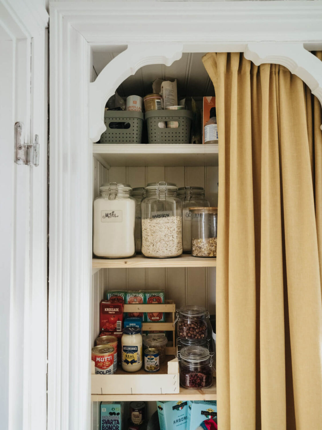 Light-Filled Rooms in a Charming 1907 Swedish Villa 20 pantry with ochre curtain