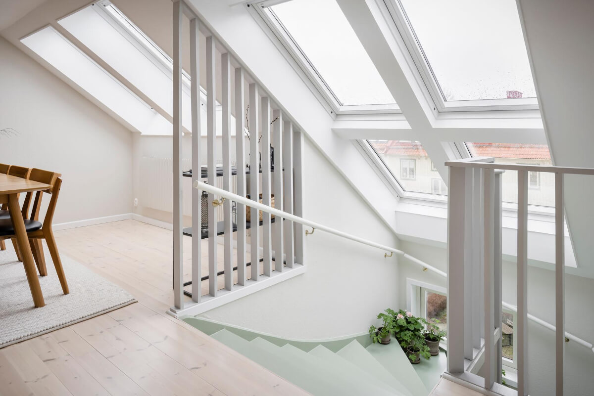 Timeless Charm and Contemporary Design in a 1930s Duplex Apartment 15 pastel green staircase