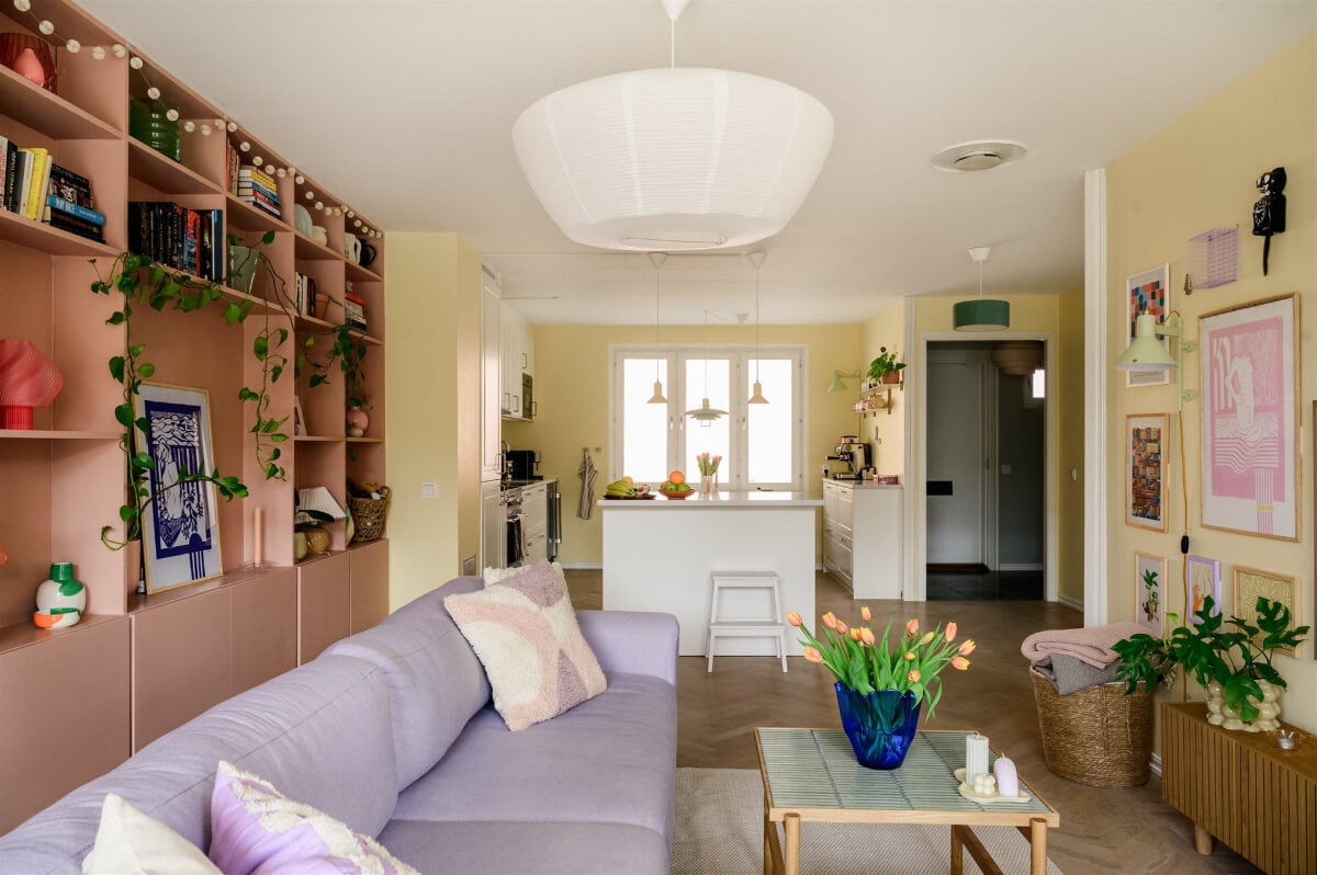 Colorful Rooms in a Bright Two-Bedroom Stockholm Apartment 7 pastel yellow and pink open-plan living room