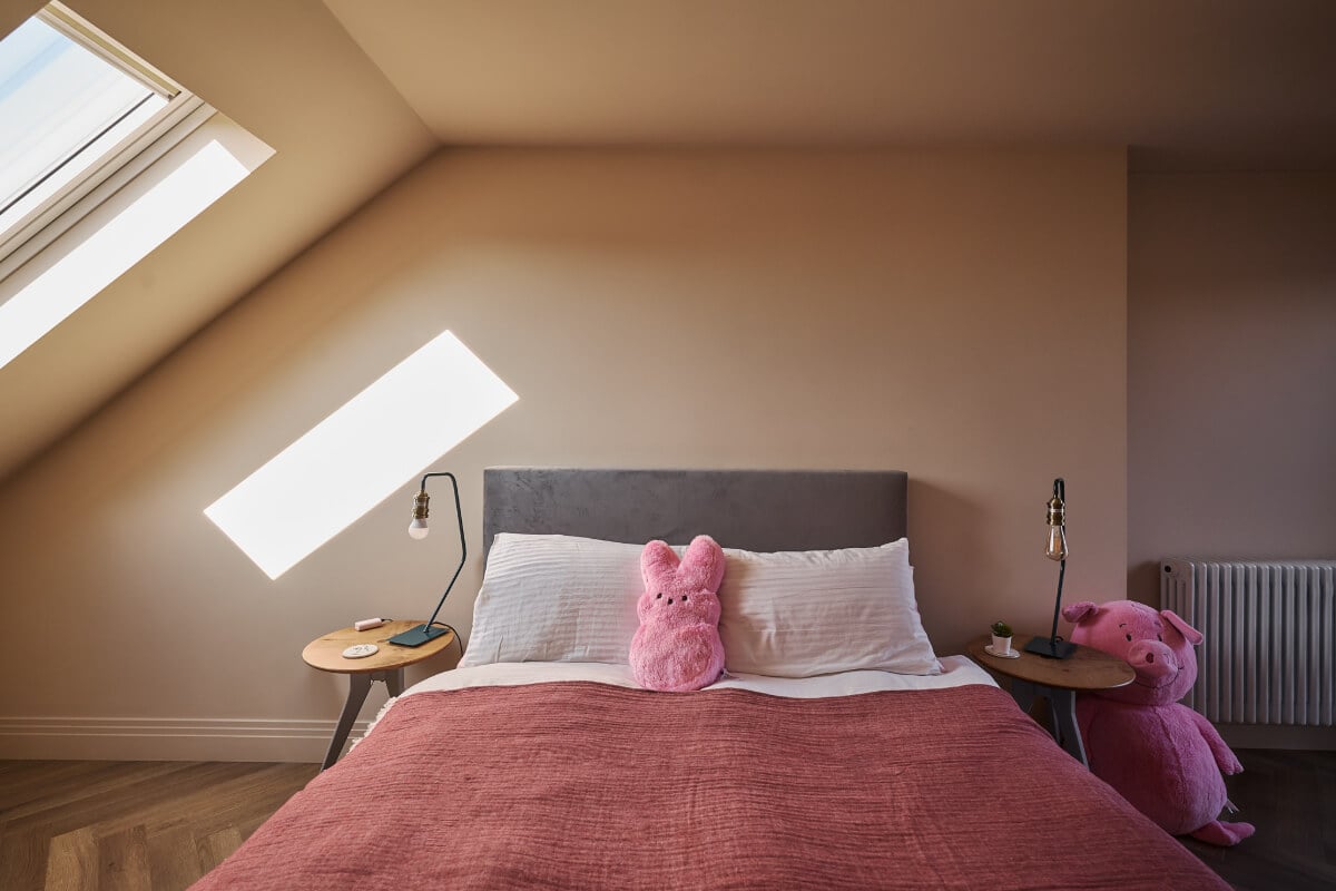 A Beautiful Extended Edwardian House Blends Period Features with Modern Design 29 pink attic bedroom