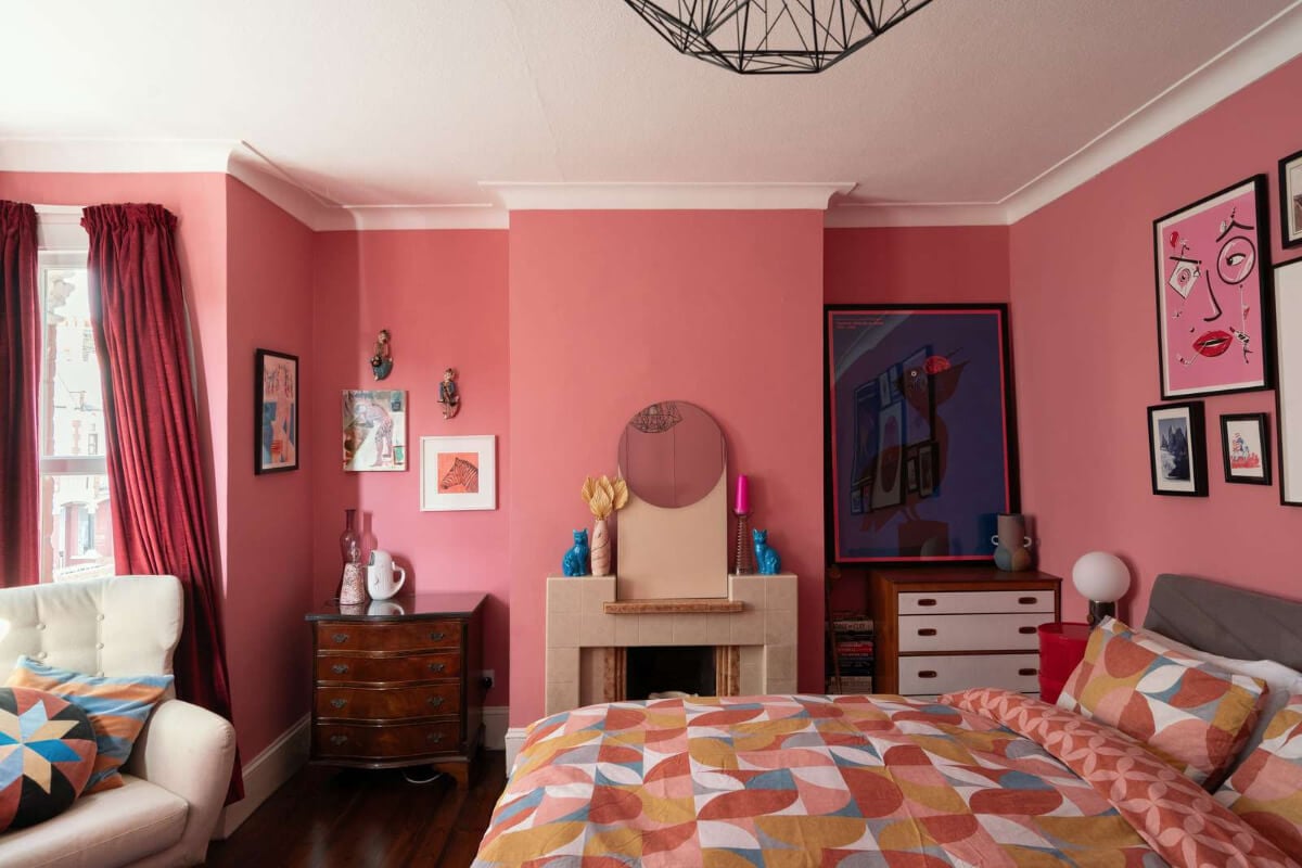 A Colorful Home with a Gold Extension in North London 15 pink bedroom with fireplace