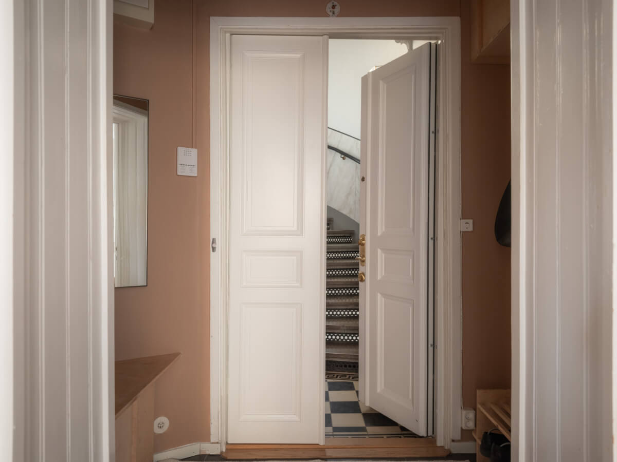 A Calm Color Palette in a Charming Swedish Apartment 24 pink hall double doors A Calm Color Palette in a Charming Swedish Apartment