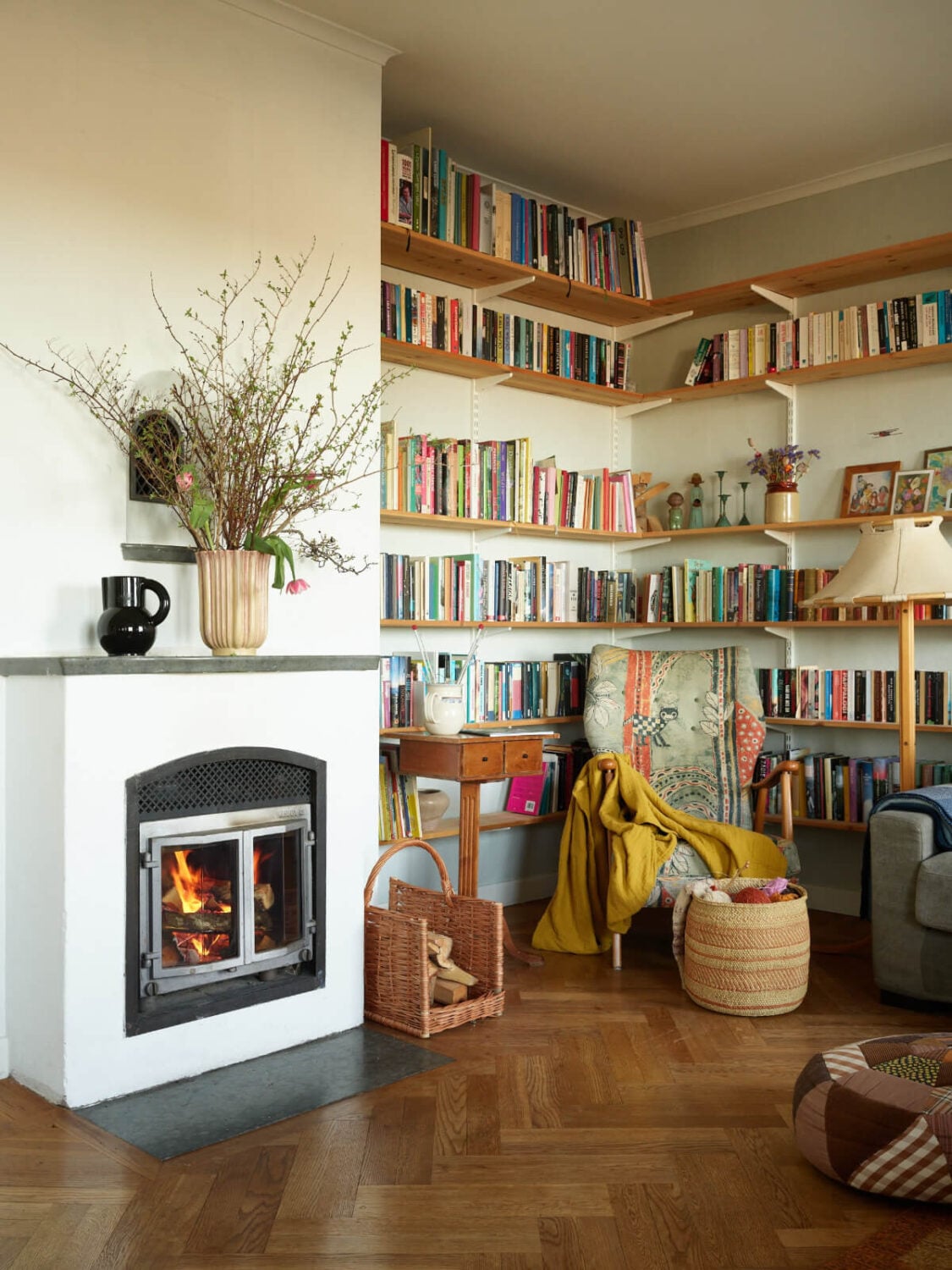 A Grand Family Home in a Former Swedish Doctor's Villa 2 reading nook with shelves and fireplace