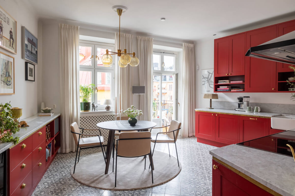 A Red Kitchen in a Grand Swedish Corner Apartment 11 red kitchen brass handles round dining table