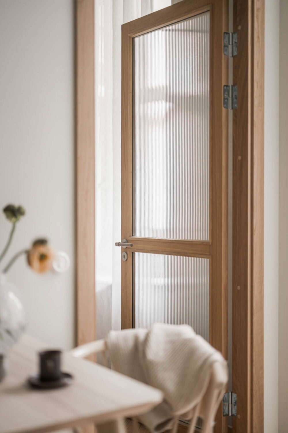 A Light-Filled Contemporary Swedish Apartment 12 reeded glass door