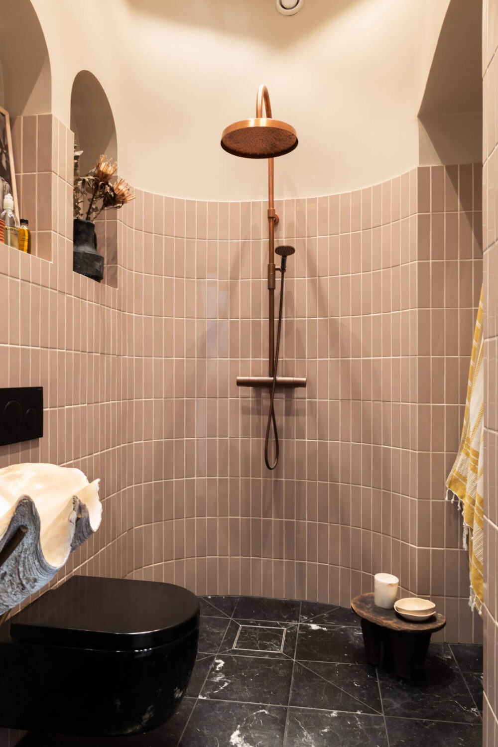 The Top Home Design Trends for 2026: Bold Color, Cozy Corners & Climate-Ready Living 29 rounded bathroom with storage niches