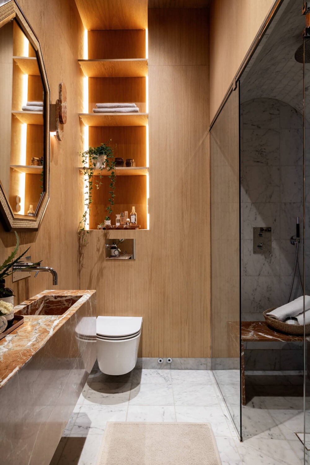 A Luxurious Stockholm Apartment with Period Features and a Blue Fireplace 22 sauna room wooden walls built-in shelves marble floor tiles