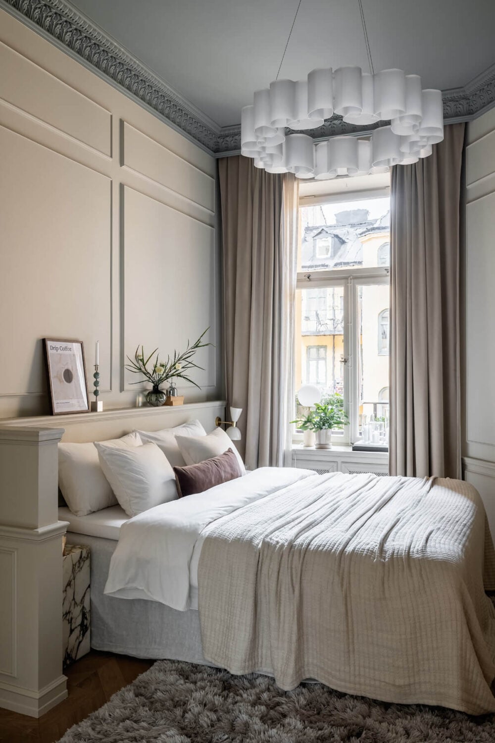 A Luxurious Stockholm Apartment with Period Features and a Blue Fireplace 14 serene bedroom painted ceiling marble nightstand nordroom
