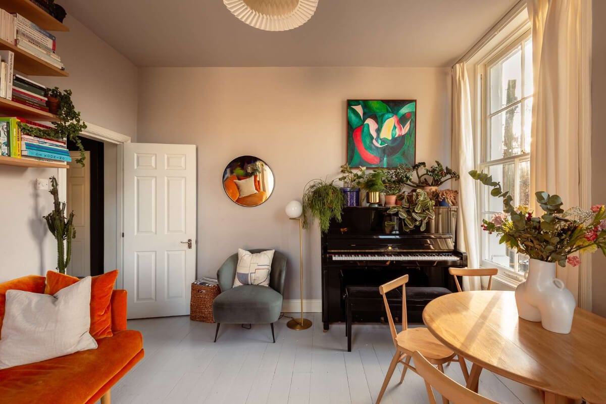 A Corner Apartment with Large Windows in a Former London Pub 5 serene living room painted floorboards piano