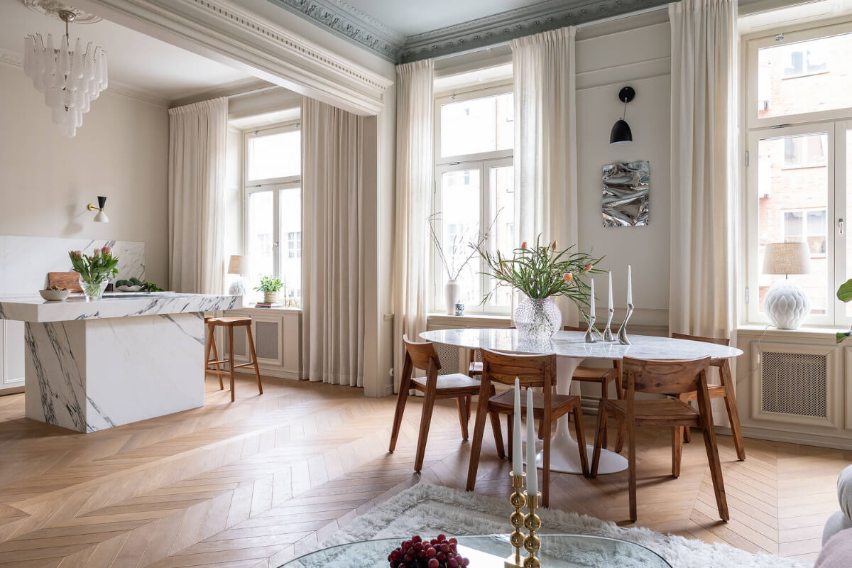 A Luxurious Stockholm Apartment with Period Features and a Blue Fireplace 7 serene open plan living space chevron floor painted ceiling