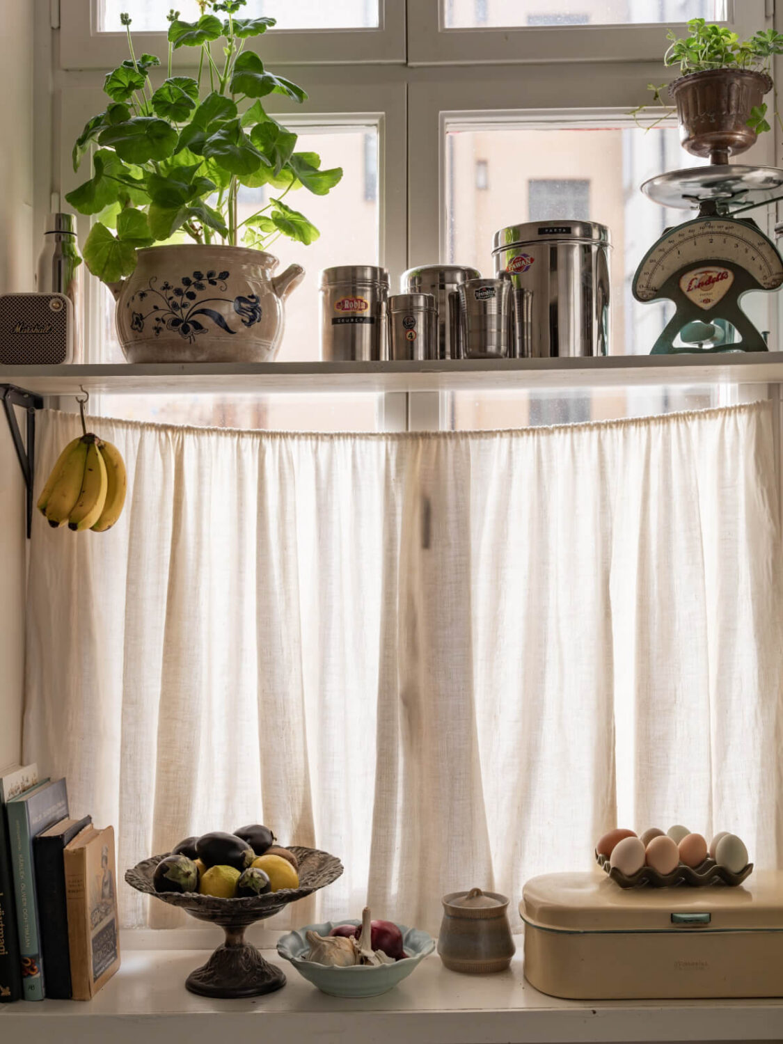 Time Has Stood Still in This Stockholm Studio Apartment 15 shelf in front of window