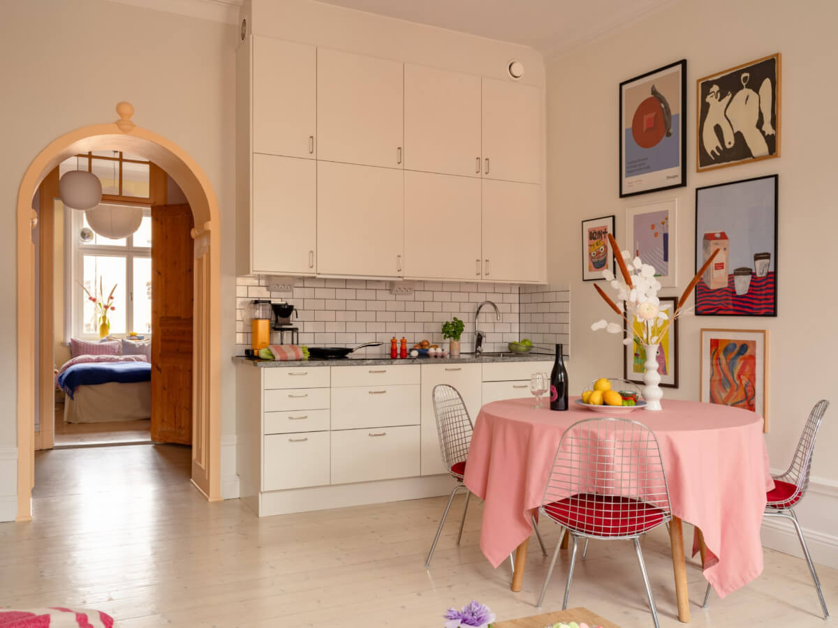 Cheerful Color Accents in a One-Bedroom Stockholm Apartment 6 simple white kitchen with round table
