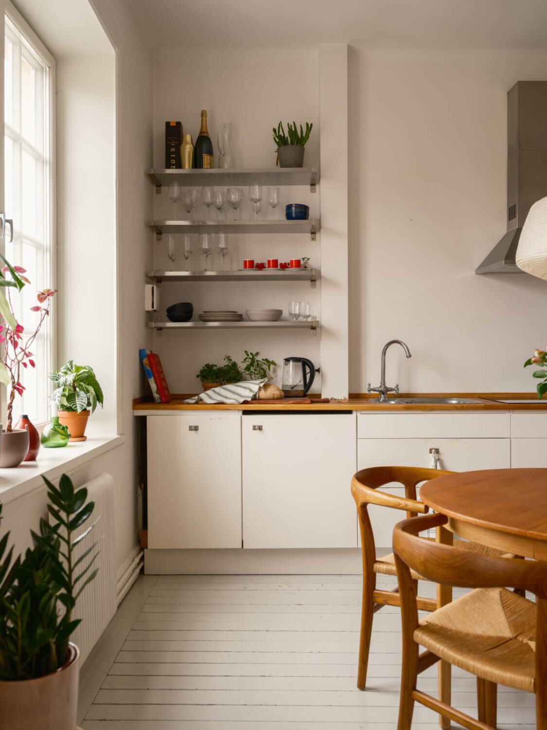 A Studio Apartment with an Exposed Brick Wall 8 simple white kitchen with shelves