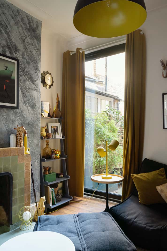 A Colorful Home with a Gold Extension in North London 13 sitting room fireplace large window