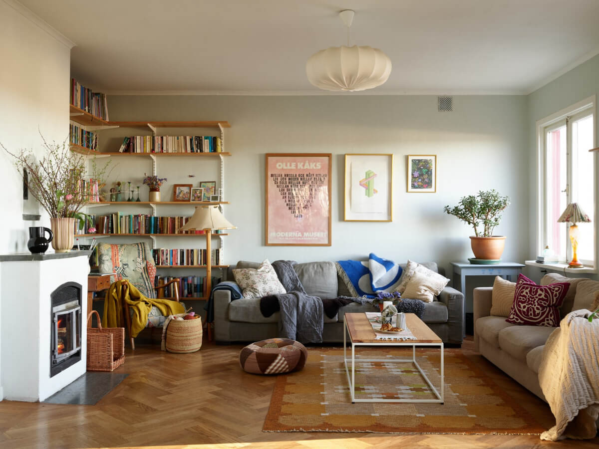 A Grand Family Home in a Former Swedish Doctor's Villa 1 sitting room with bookshelves and fireplace