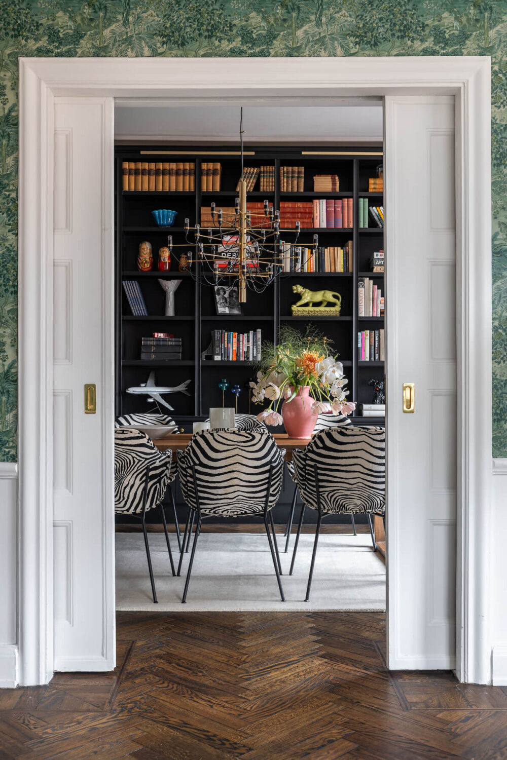 A Red Kitchen in a Grand Swedish Corner Apartment 3 sliding doors into dining room