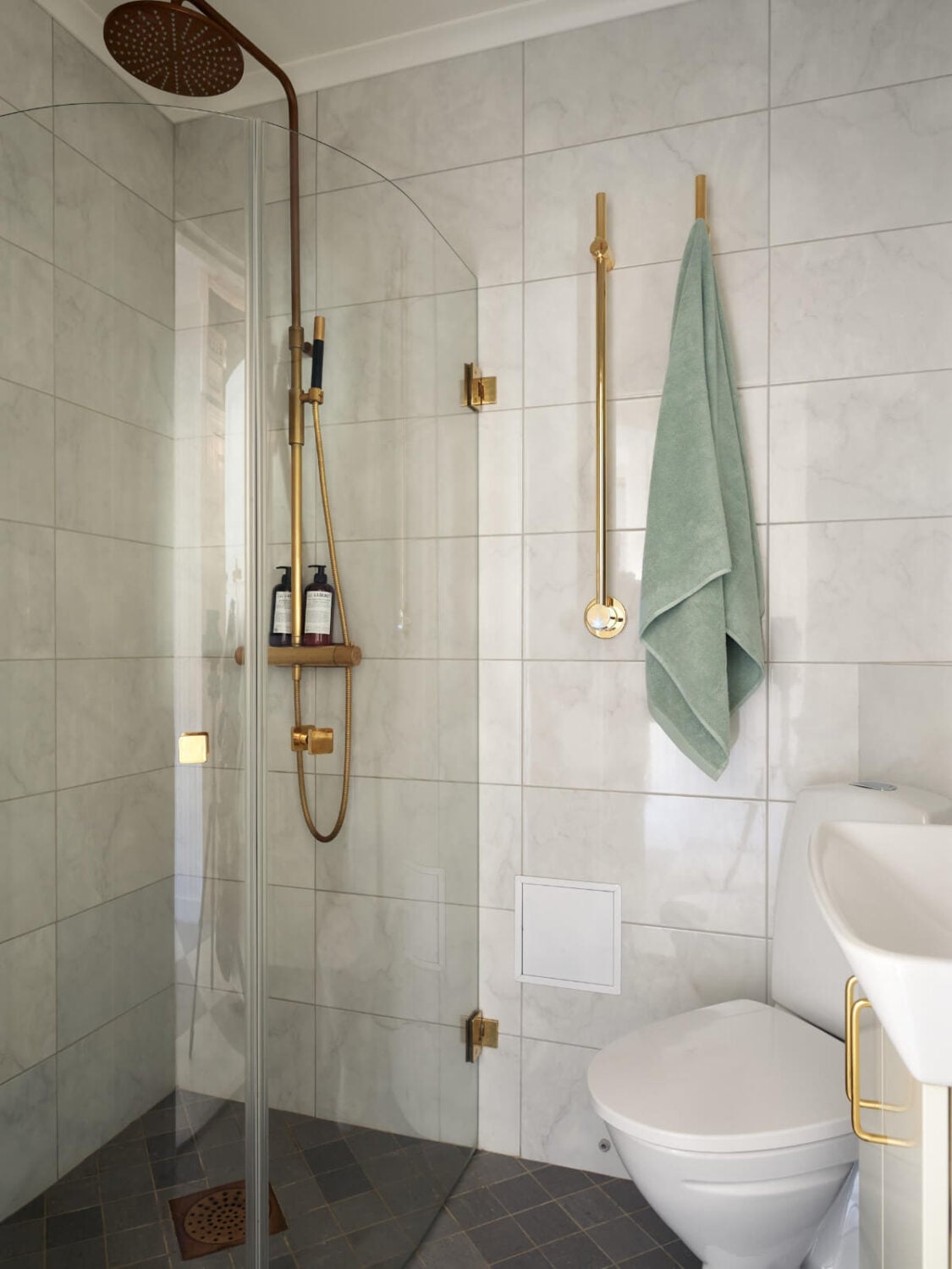 Light-Filled Rooms and a Charming Veranda in a Swedish Apartment 26 small bathroom brass fittings