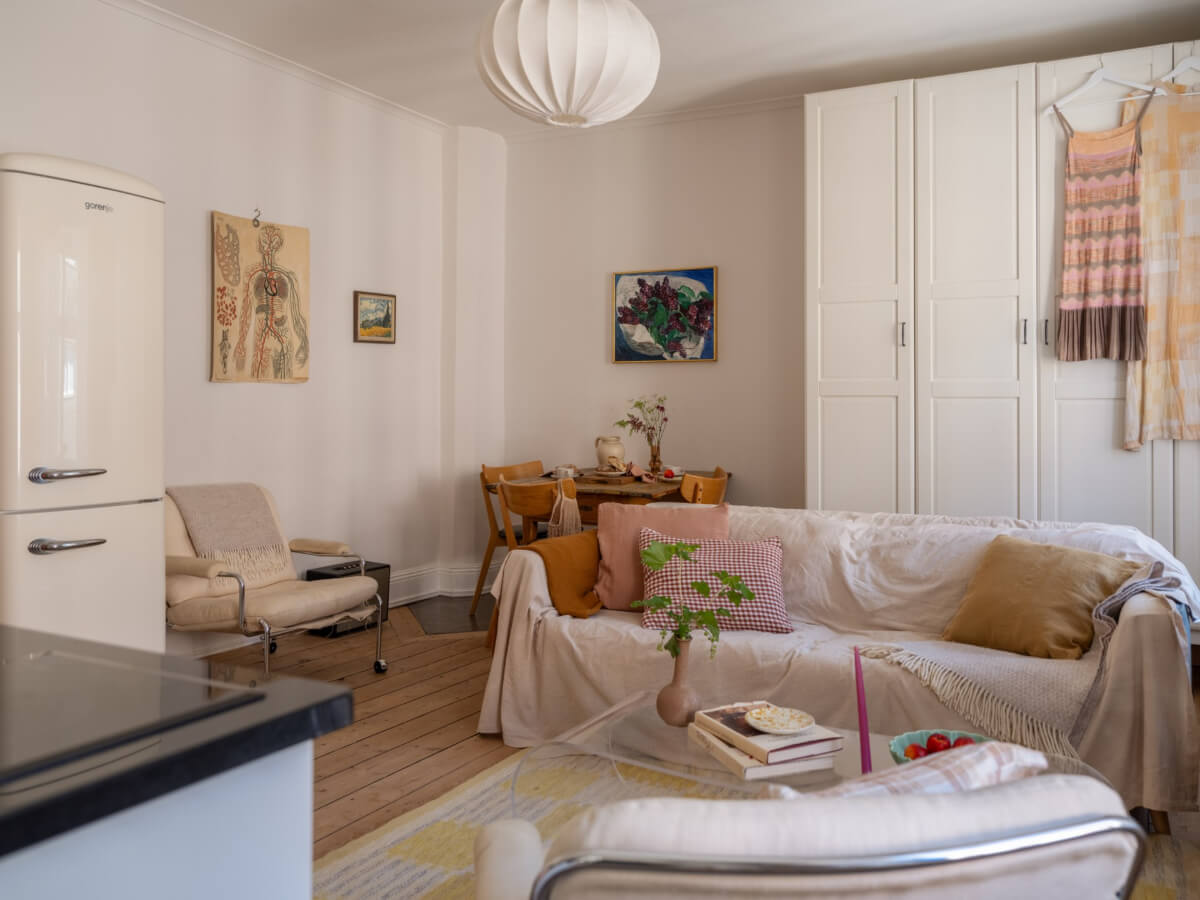 A Small Apartment with Rustic Floorboards and Beige Walls 9 small living room kitchen rustic floorboards