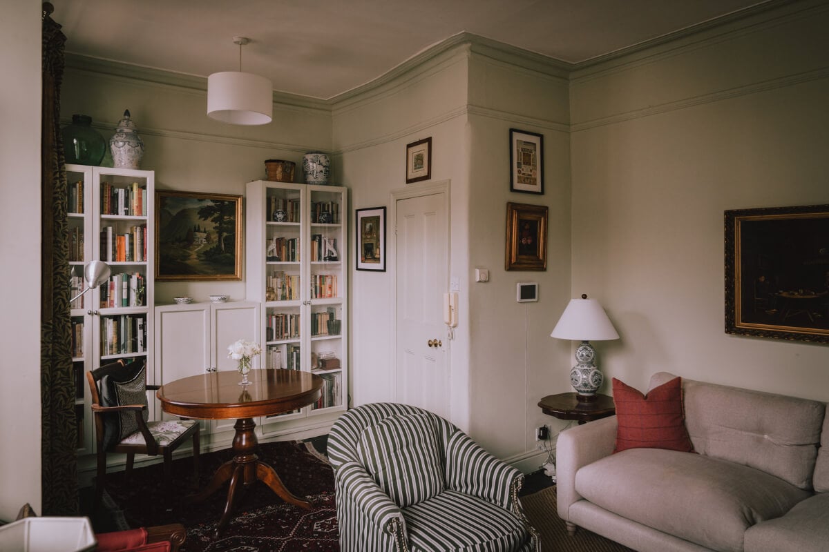 A Carefully Restored Edwardian Apartment with a Garden 4 small living room with antique table