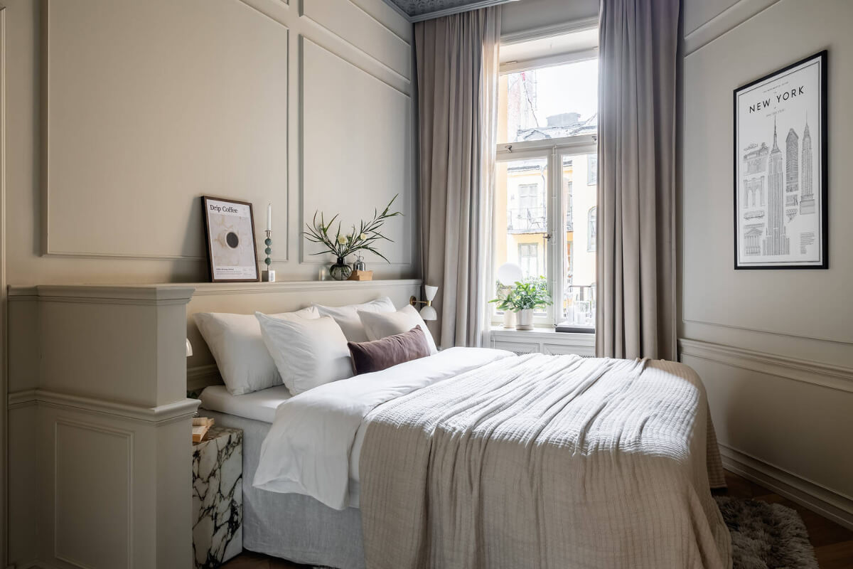 A Luxurious Stockholm Apartment with Period Features and a Blue Fireplace 13 small luxury bedroom marble nightstand