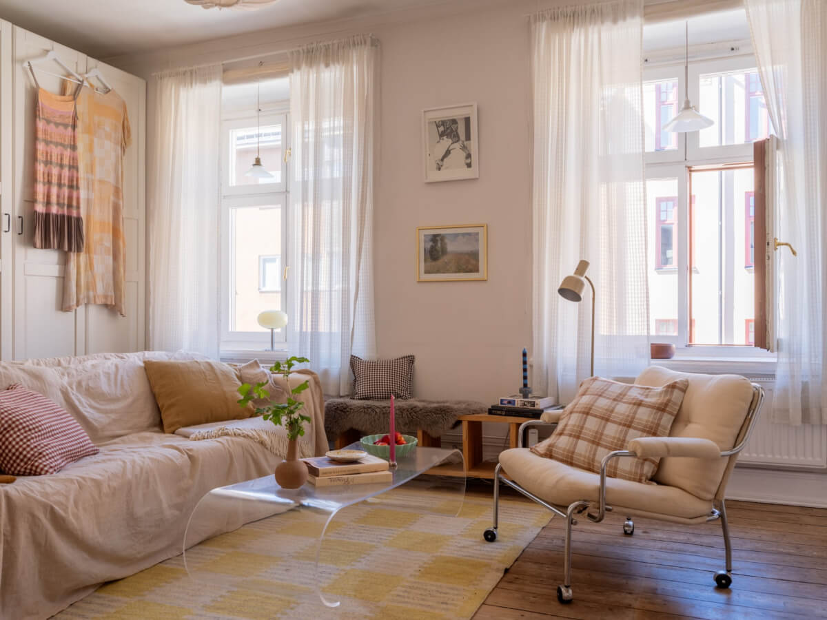 A Small Apartment with Rustic Floorboards and Beige Walls 1 small scandi living room rustic wooden floorboards yellow rug
