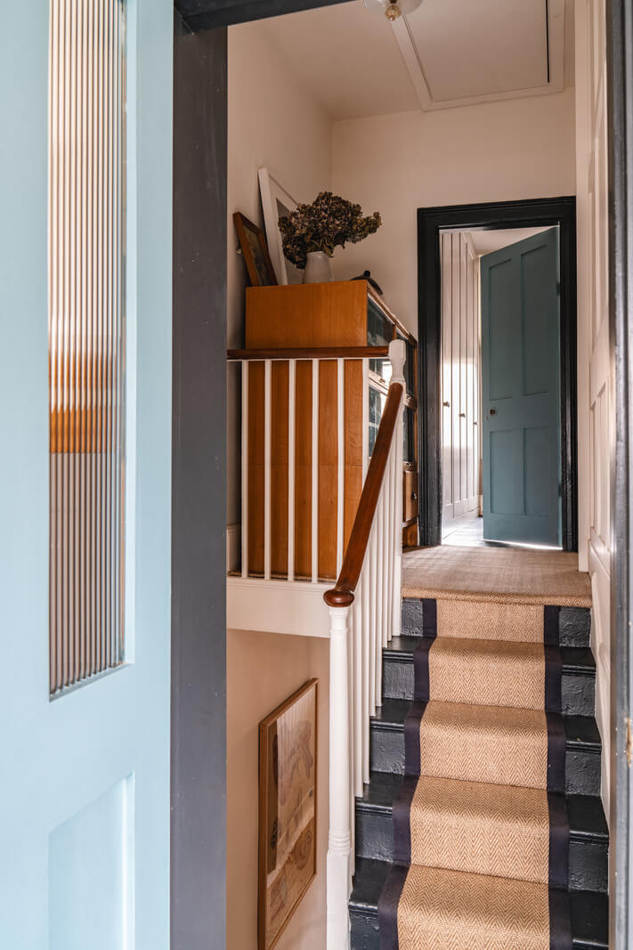 A Cozy Victorian Home Painted in Moody Blue and Gray Tones 26 staircase
