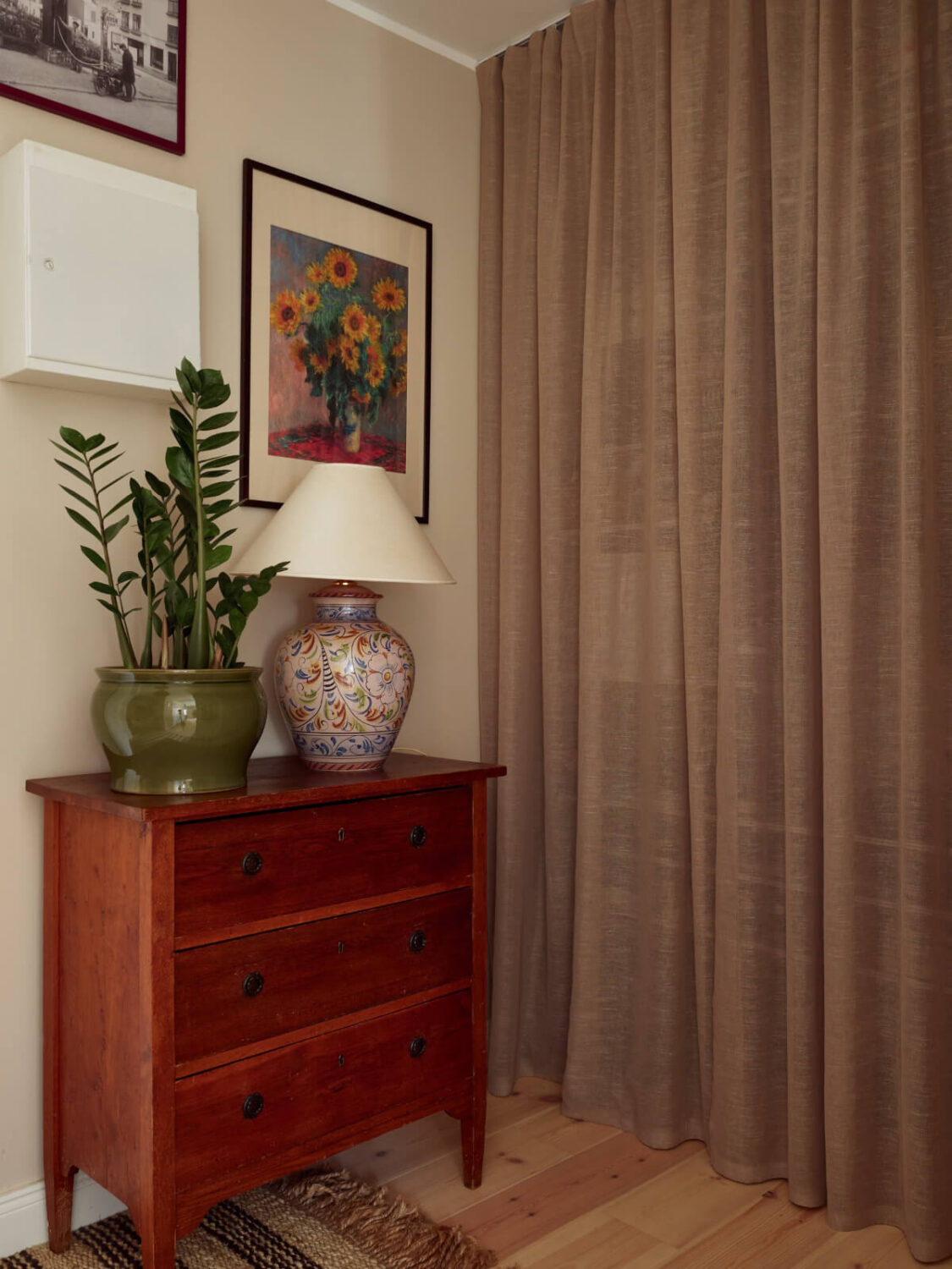 A Green Kitchen and a Pink Bedroom in a Charming Apartment 19 storage space behind curtain