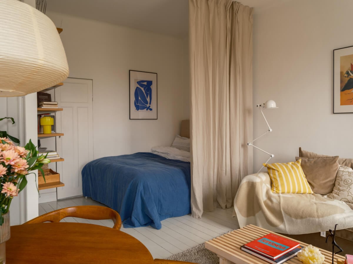 A Studio Apartment with an Exposed Brick Wall 9 studio apartment curtain room divider