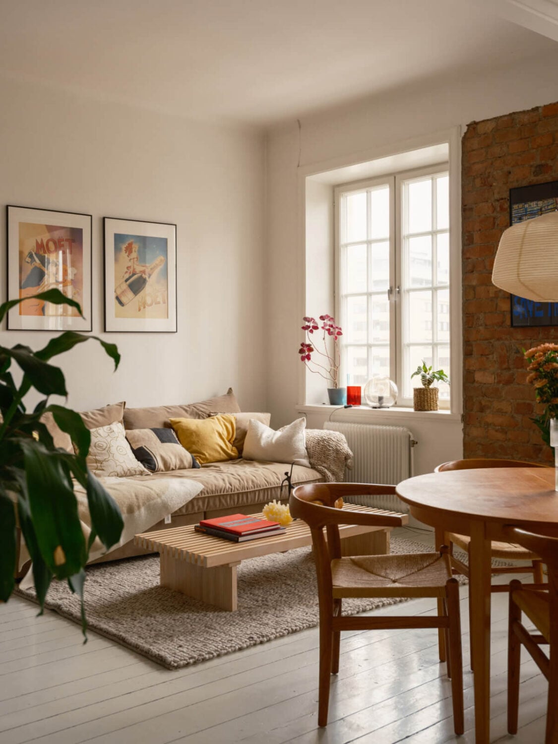 A Studio Apartment with an Exposed Brick Wall 3 studio apartment white floorboards exposed brick
