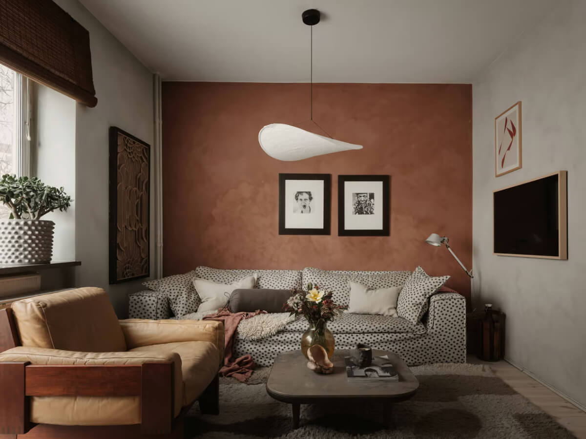 Limewash Walls in Muted Tones in a Swedish Apartment 4 terracotta accent wall