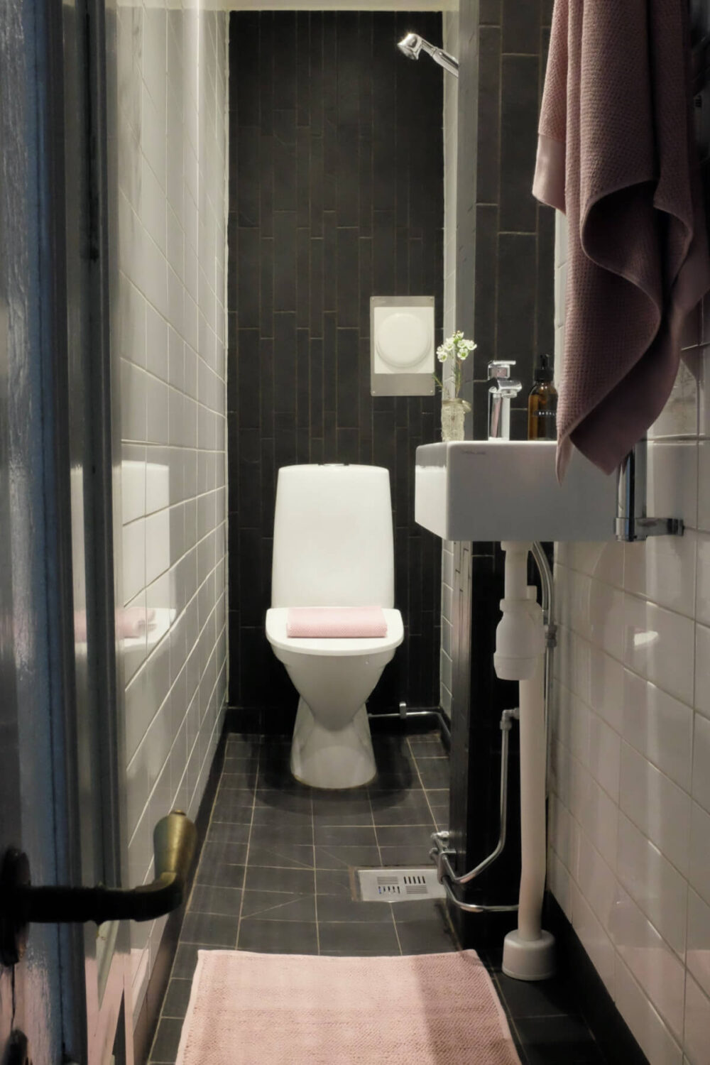 Time Has Stood Still in This Stockholm Studio Apartment 22 tiny modern black and white bathroom