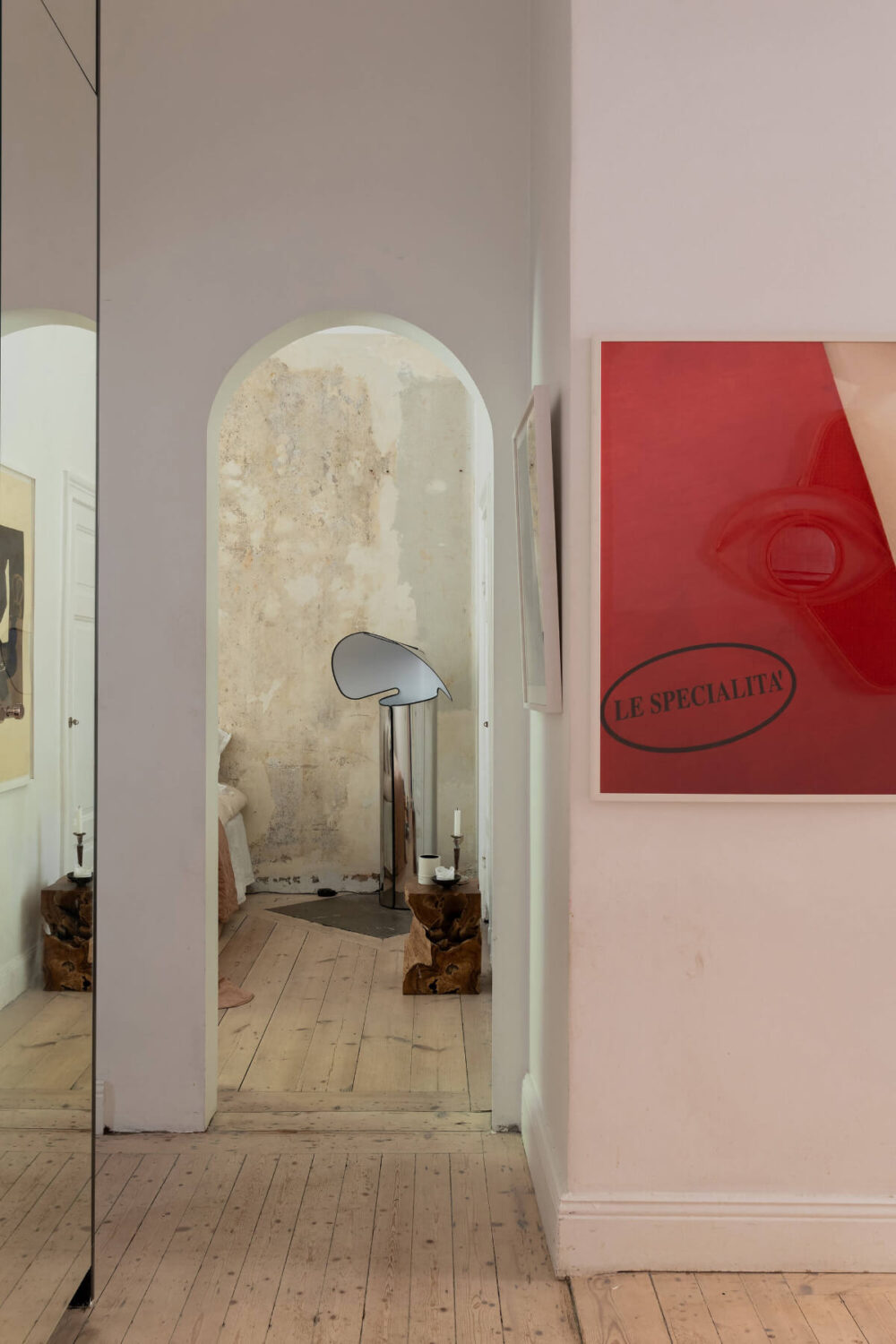 Arches and a Wall Mural in a Swedish Apartment 14 view-into-bedroom