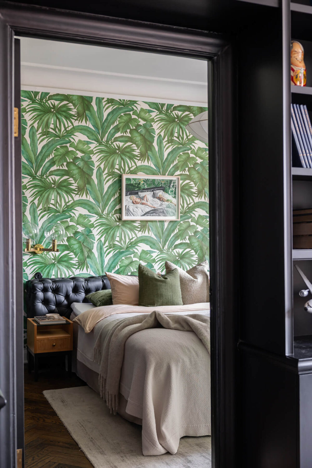 A Red Kitchen in a Grand Swedish Corner Apartment 20 view into bedroom green leaf wallpaper