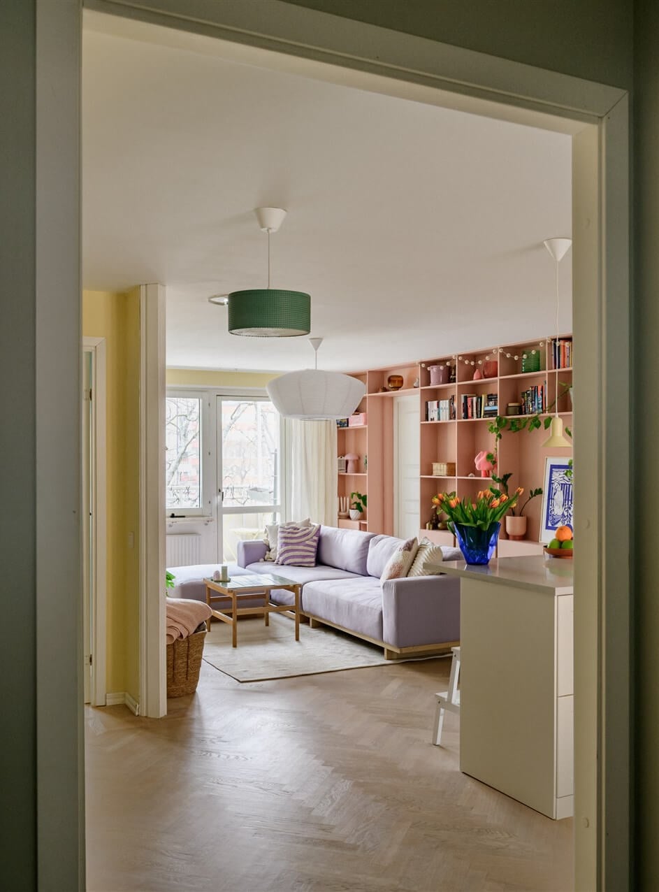 Colorful Rooms in a Bright Two-Bedroom Stockholm Apartment 9 view into yellow living room
