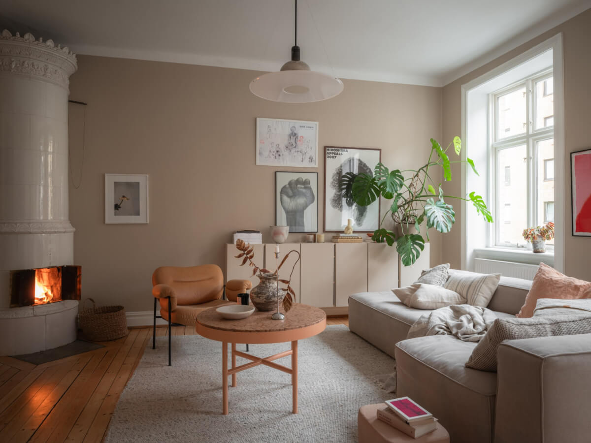 A Calm Color Palette in a Charming Swedish Apartment 1 warm beige living room fireplace