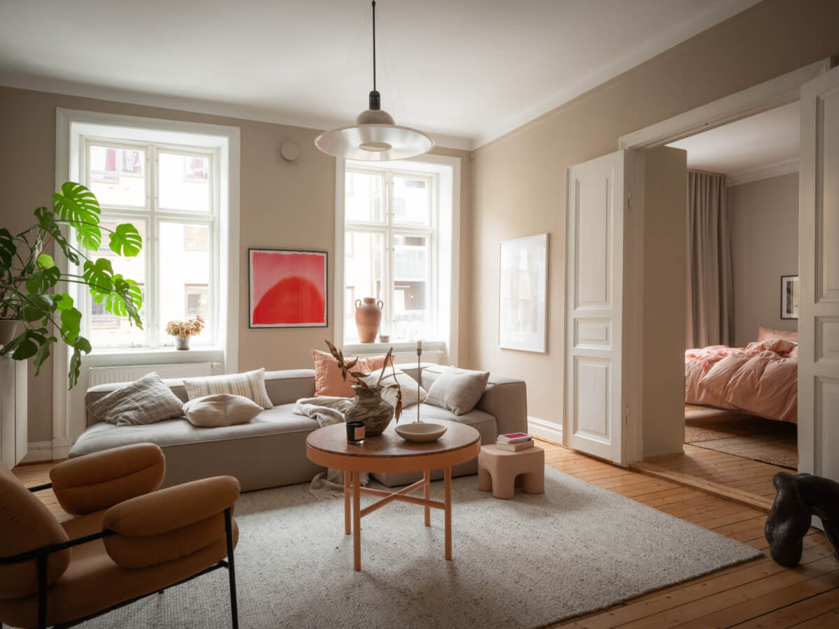 A Calm Color Palette in a Charming Swedish Apartment 5 warm beige living room wooden floor