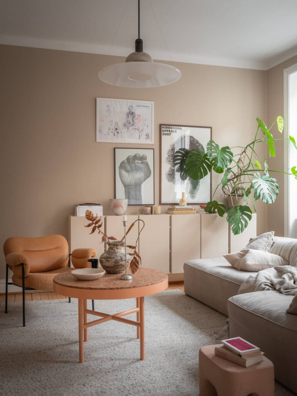 A Calm Color Palette in a Charming Swedish Apartment 2 warm beige walls living room