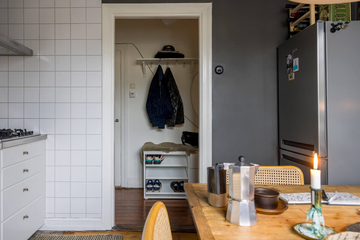 A Cozy Studio Apartment in a 1930s Building 13 white and gray kitchen