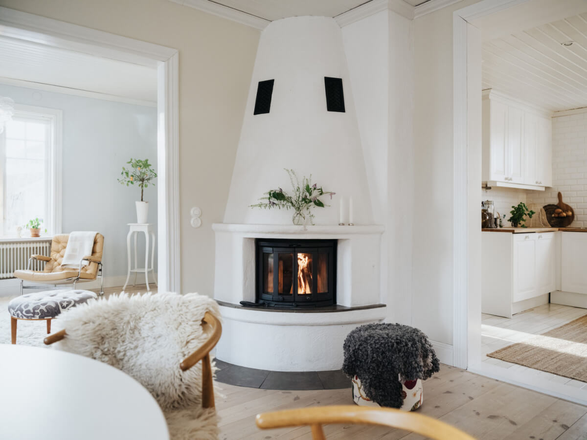 Light-Filled Rooms in a Charming 1907 Swedish Villa 11 white fireplace