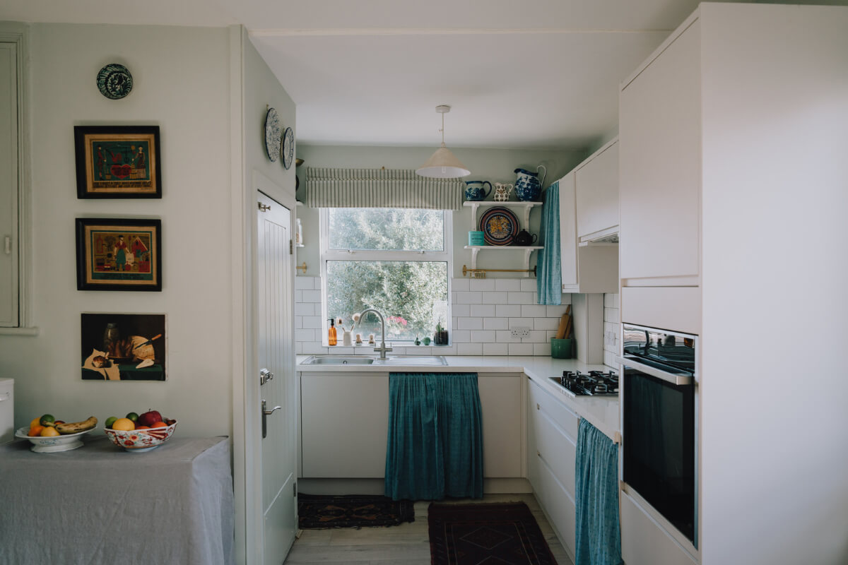 A Carefully Restored Edwardian Apartment with a Garden 7 white kitchen
