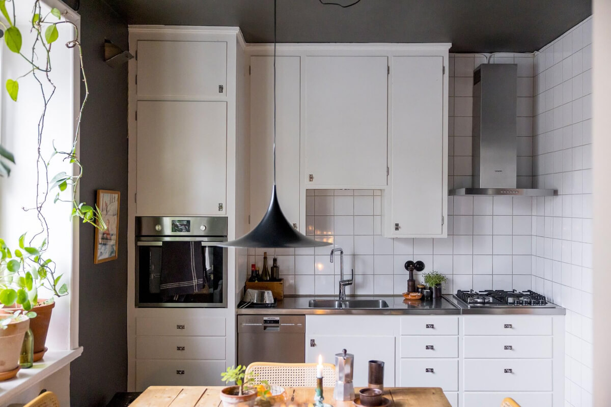 A Cozy Studio Apartment in a 1930s Building 8 white kitchen cabinets