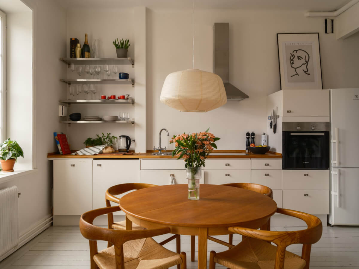 A Studio Apartment with an Exposed Brick Wall 7 white kitchen stainless steel shelves
