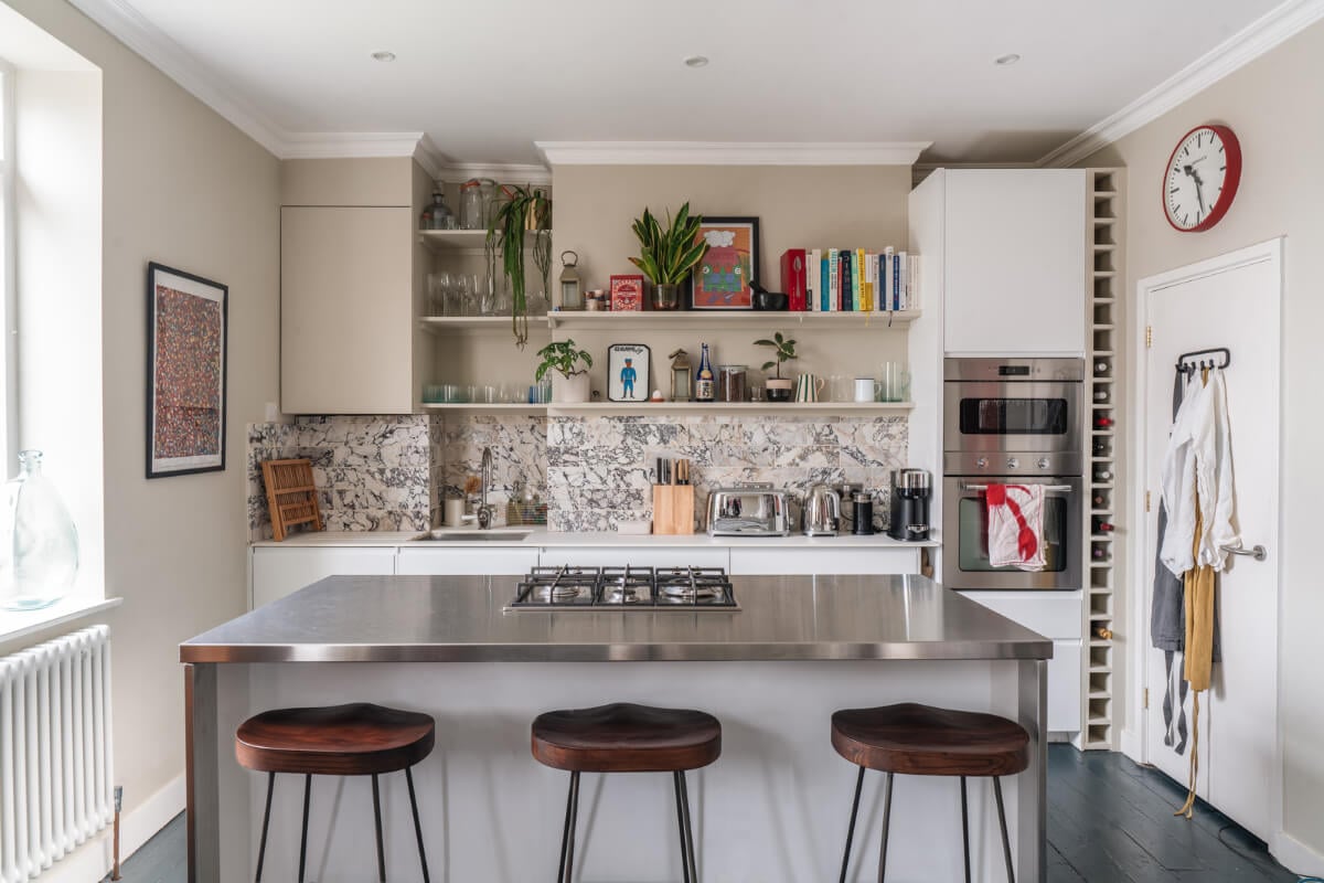 A Cozy Two-Bedroom Attic Apartment in a Victorian Townhouse 5 white kitchen with island beige walls