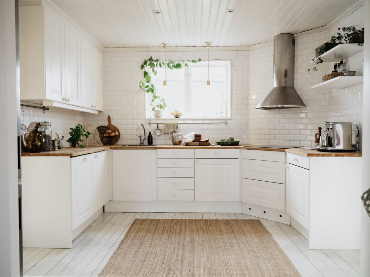Light-Filled Rooms in a Charming 1907 Swedish Villa 17 white kitchen wooden countertop