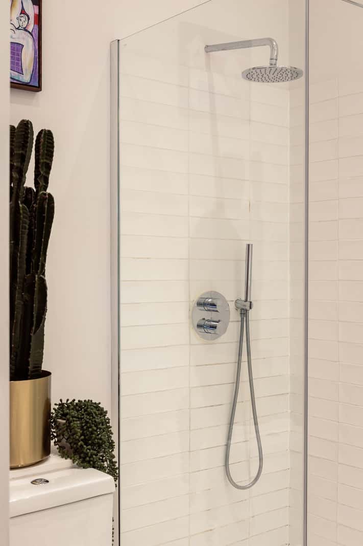 A Corner Apartment with Large Windows in a Former London Pub 18 white tiles bathroom