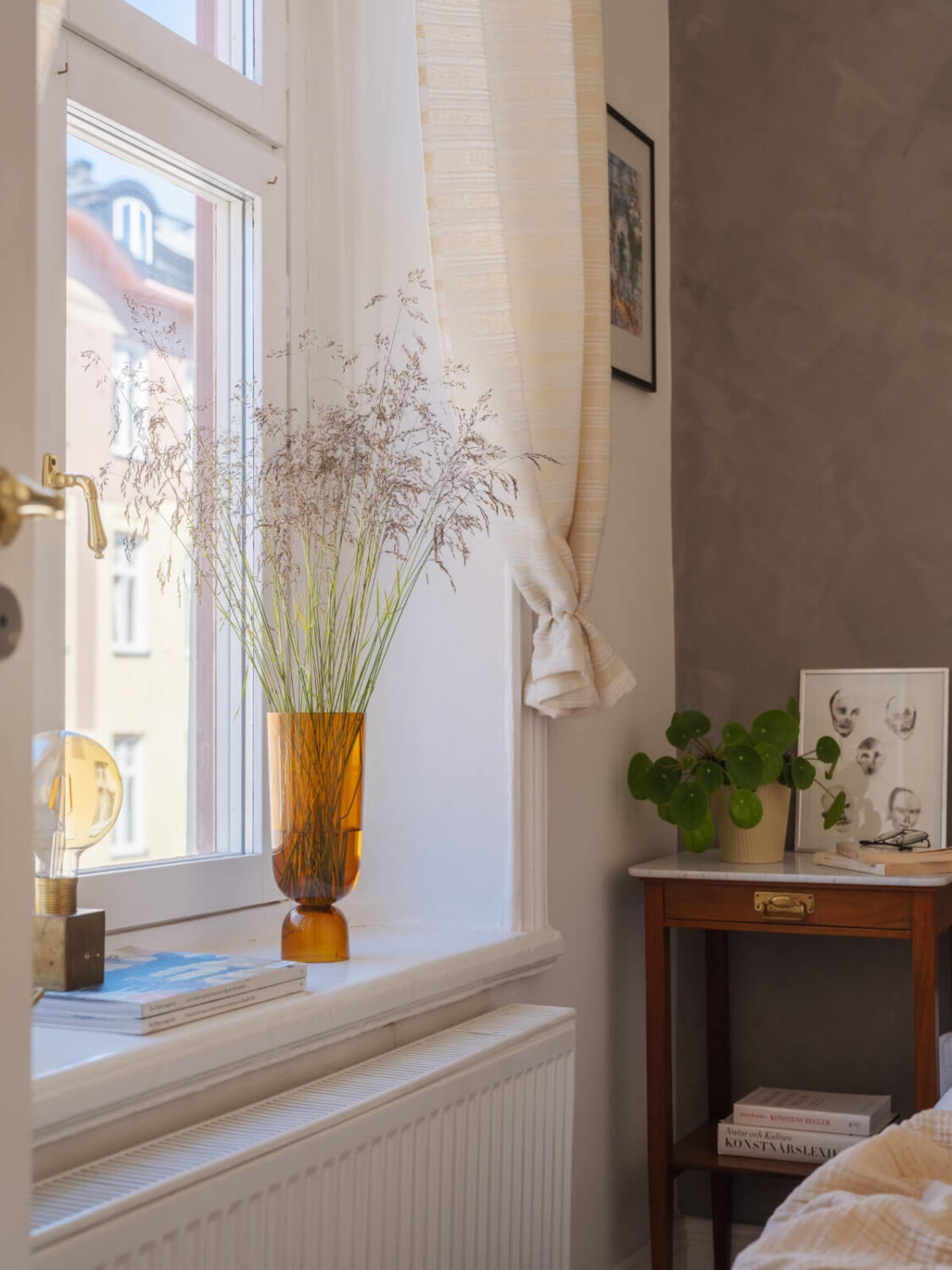 A Small Apartment with Rustic Floorboards and Beige Walls 18 window sill