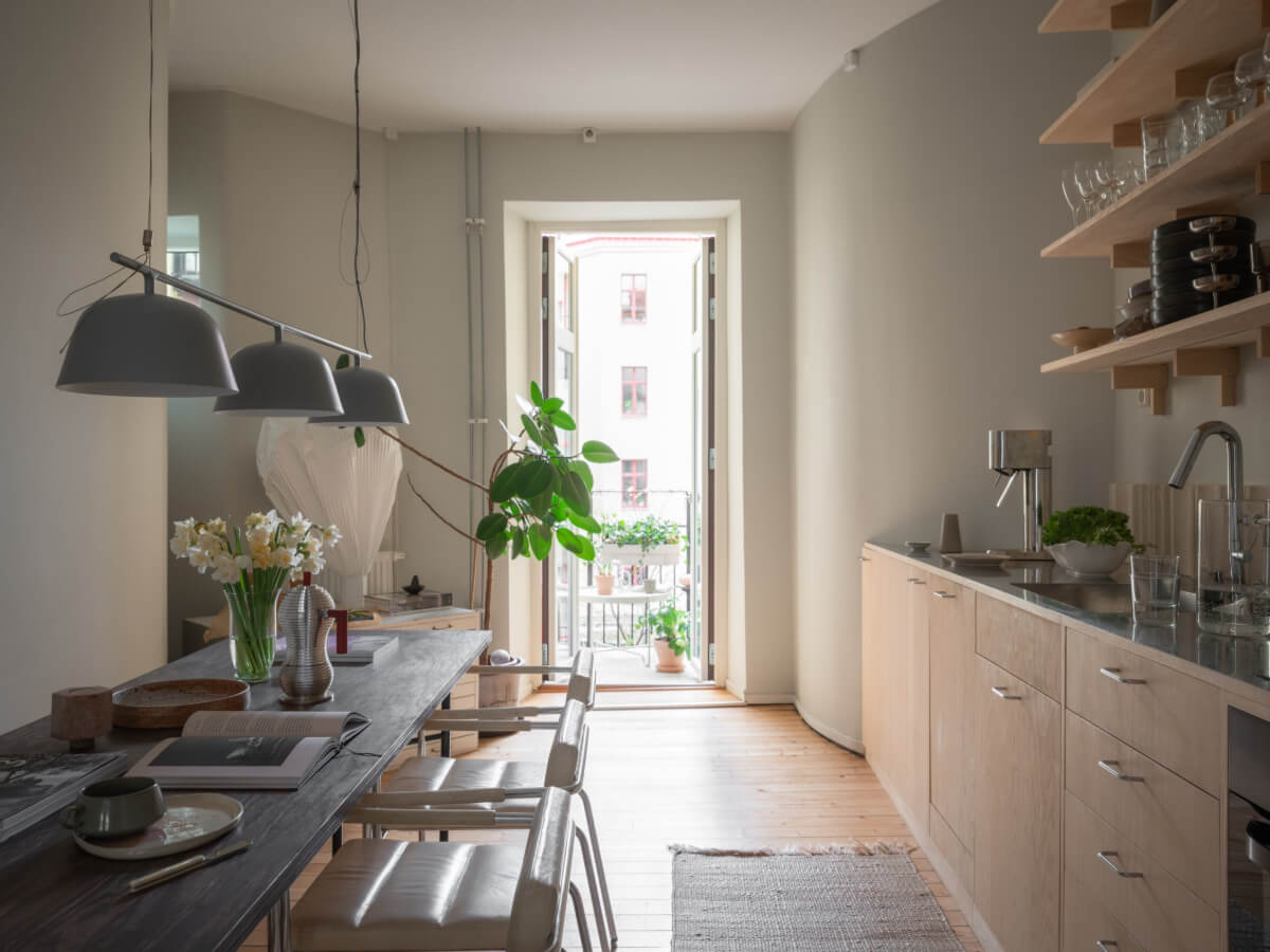 A Calm Color Palette in a Charming Swedish Apartment 9 wooden kitchen large dining table
