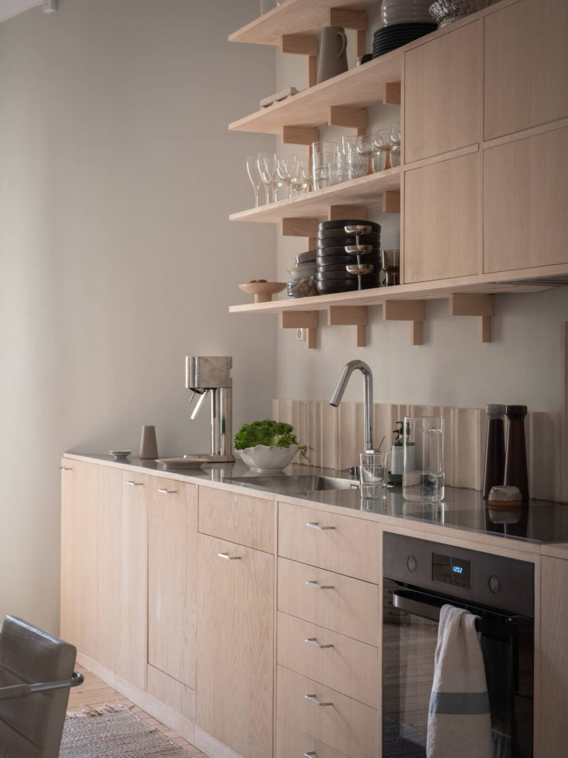 A Calm Color Palette in a Charming Swedish Apartment 12 wooden kitchen shelves