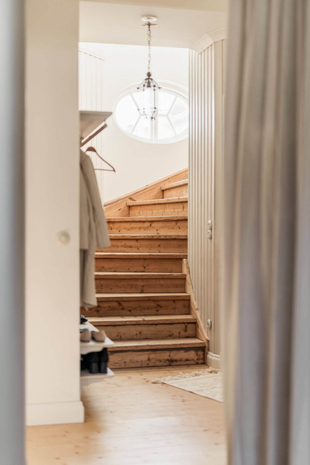 A Swedish Duplex Apartment Inspired by A Danish Summer House 40 wooden staircase with round mirror