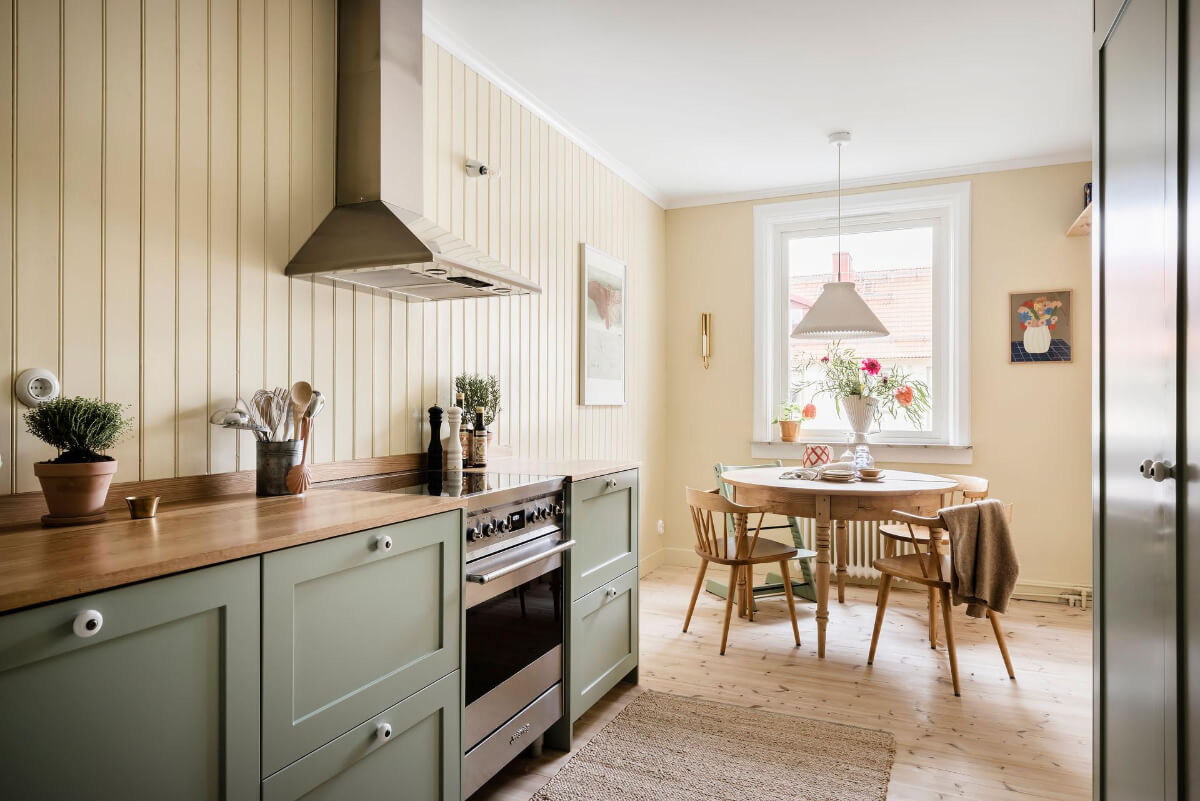 Timeless Charm and Contemporary Design in a 1930s Duplex Apartment 7 yellow and green kitchen round dining table